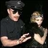 Flapper girl Madonna and Village People cop Guy - click to enlarge