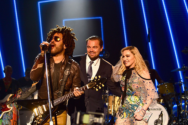 Madonna on stage with Leonardo Dicaprio and Lenny Kravitz