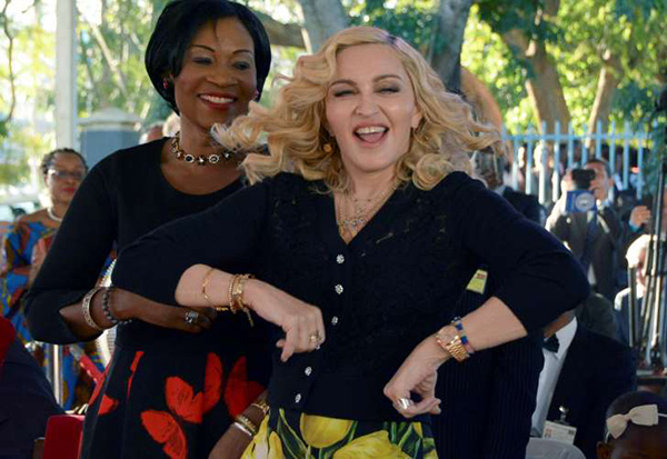 Madonna dances at the opening of the Mercy James Center in Malawi