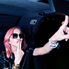 Madonna with pink hair, posing posing in a Mercedes Benz.