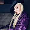 Madonna in a purple Prada outfit. Photo by Ricardo Gomes.