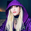 Madonna in a purple Prada outfit. Photo by Ricardo Gomes.